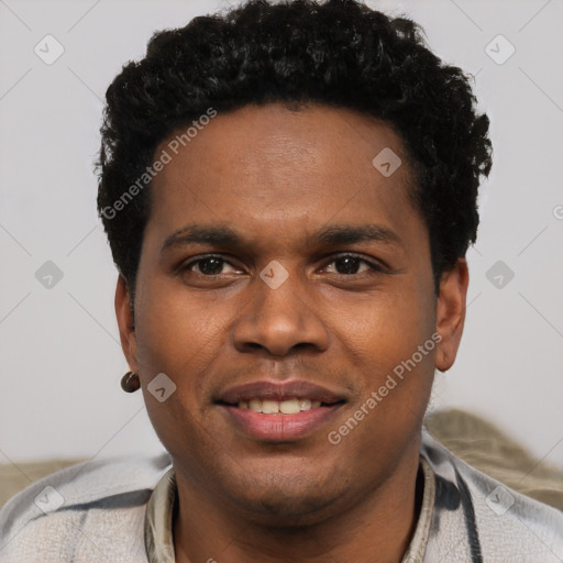 Joyful black young-adult male with short  black hair and brown eyes