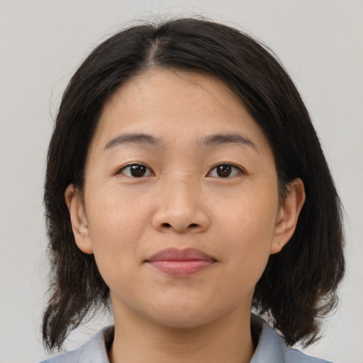 Neutral asian young-adult female with medium  brown hair and brown eyes