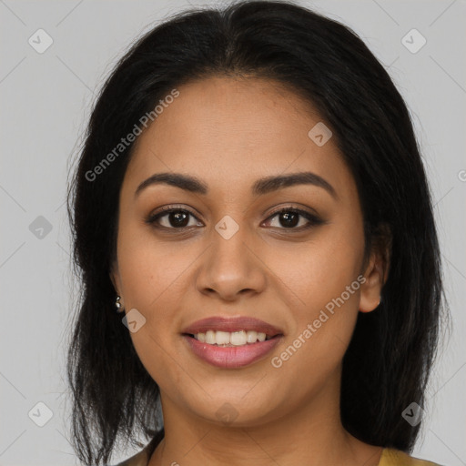 Joyful latino young-adult female with long  brown hair and brown eyes