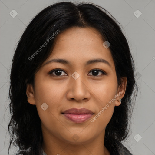 Joyful latino young-adult female with medium  brown hair and brown eyes