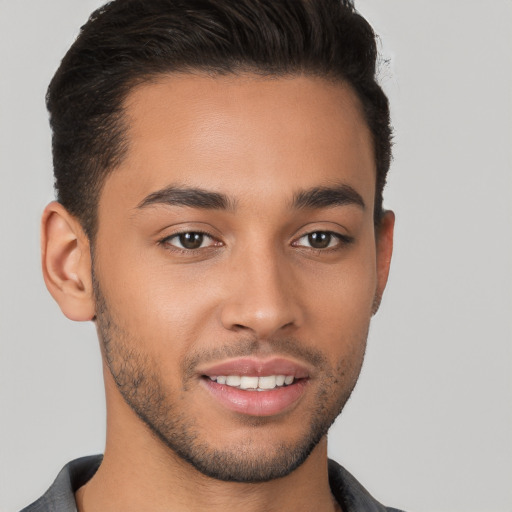 Joyful white young-adult male with short  brown hair and brown eyes