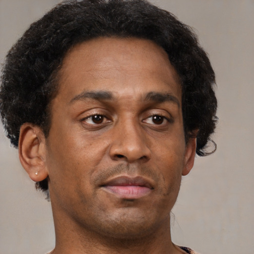 Neutral black young-adult male with short  brown hair and brown eyes