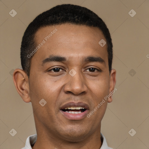 Joyful black young-adult male with short  black hair and brown eyes