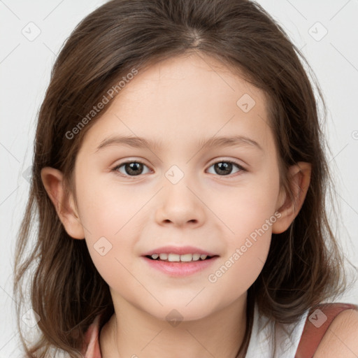 Joyful white child female with medium  brown hair and brown eyes