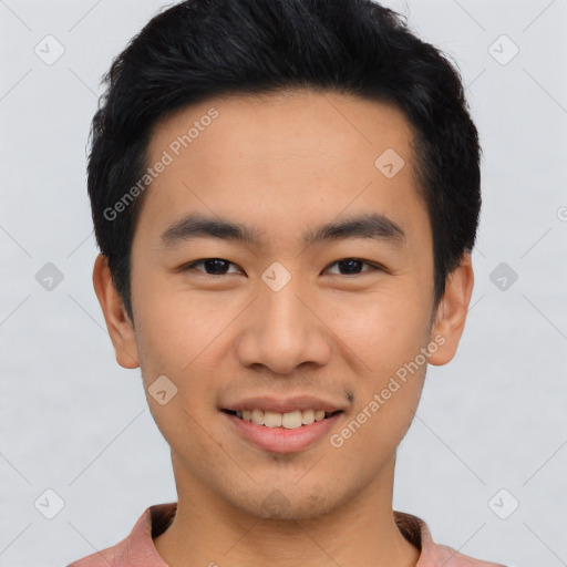 Joyful asian young-adult male with short  black hair and brown eyes