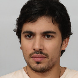 Neutral white young-adult male with short  black hair and brown eyes