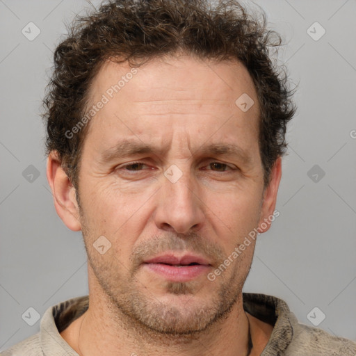 Joyful white adult male with short  brown hair and grey eyes