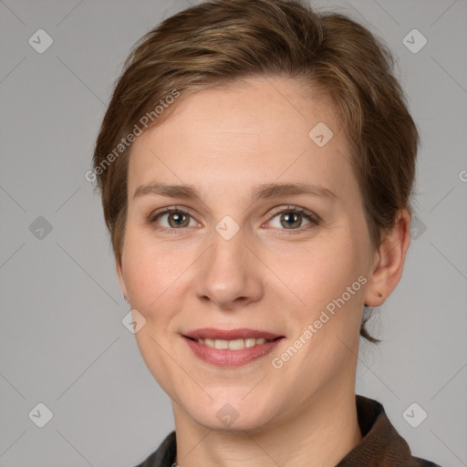 Joyful white young-adult female with short  brown hair and grey eyes