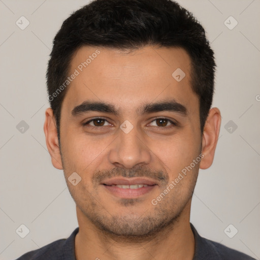 Joyful latino young-adult male with short  black hair and brown eyes