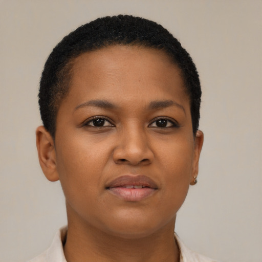 Joyful black young-adult female with short  brown hair and brown eyes