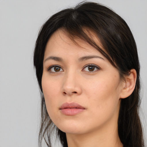 Neutral white young-adult female with long  brown hair and brown eyes