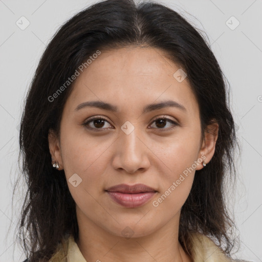 Joyful latino young-adult female with long  brown hair and brown eyes