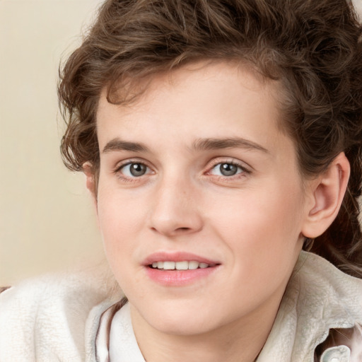 Joyful white young-adult male with medium  brown hair and grey eyes