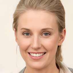 Joyful white young-adult female with medium  brown hair and blue eyes