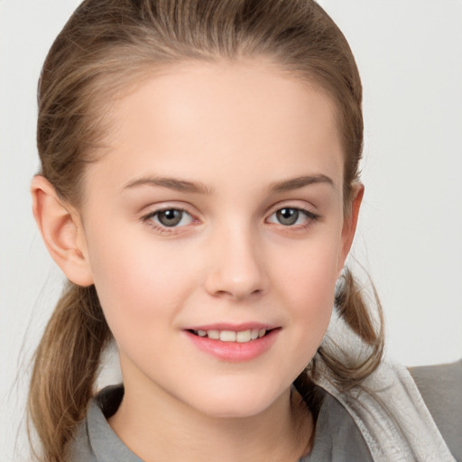 Joyful white child female with medium  brown hair and grey eyes