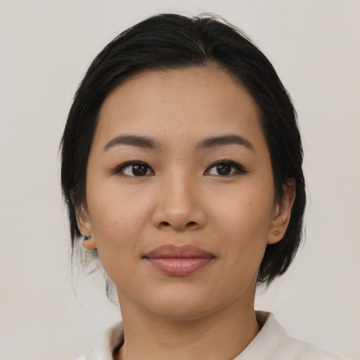 Joyful asian young-adult female with medium  black hair and brown eyes