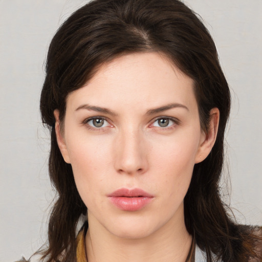 Neutral white young-adult female with medium  brown hair and brown eyes