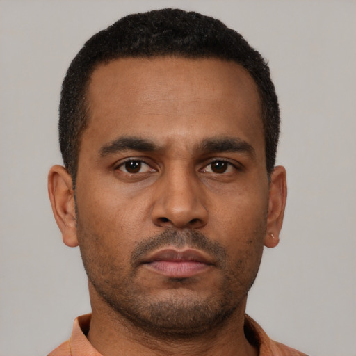 Neutral latino young-adult male with short  brown hair and brown eyes