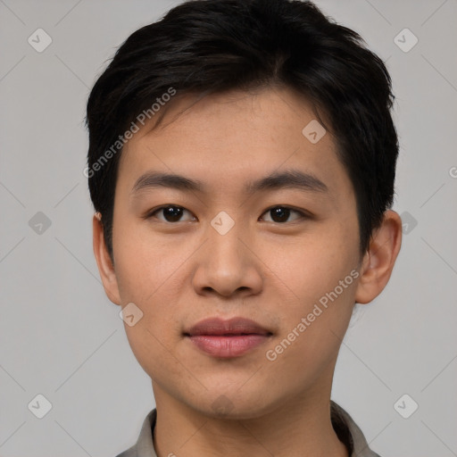 Joyful asian young-adult male with short  brown hair and brown eyes