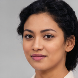 Joyful latino young-adult female with medium  black hair and brown eyes