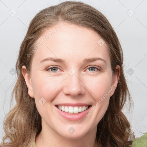 Joyful white young-adult female with medium  brown hair and blue eyes