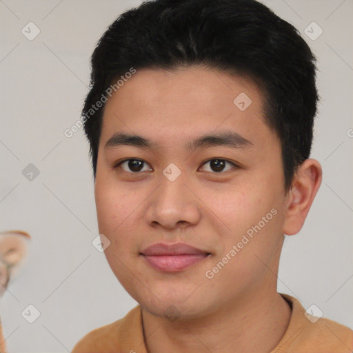 Joyful asian young-adult male with short  black hair and brown eyes