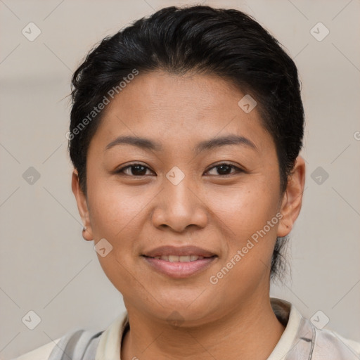 Joyful latino young-adult female with short  brown hair and brown eyes