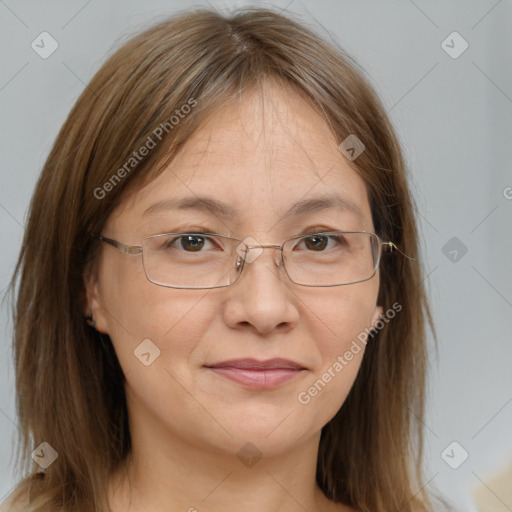 Joyful white adult female with long  brown hair and grey eyes