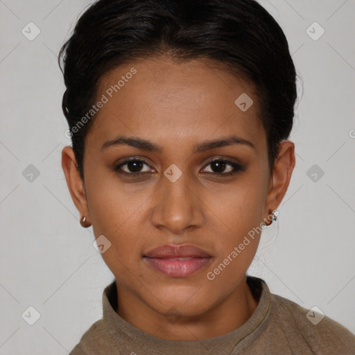 Joyful black young-adult female with short  brown hair and brown eyes