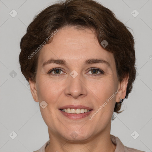 Joyful white adult female with short  brown hair and brown eyes