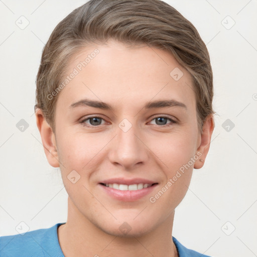 Joyful white young-adult female with short  brown hair and grey eyes