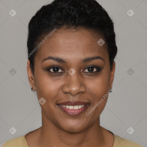 Joyful black young-adult female with short  black hair and brown eyes