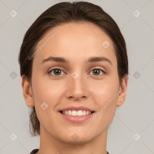 Joyful white young-adult female with medium  brown hair and green eyes