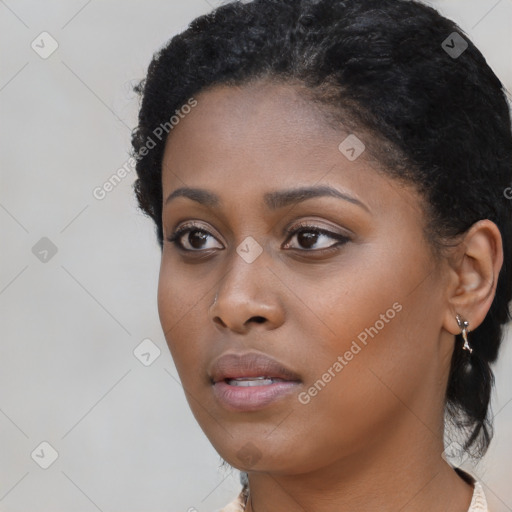 Neutral black young-adult female with short  black hair and brown eyes