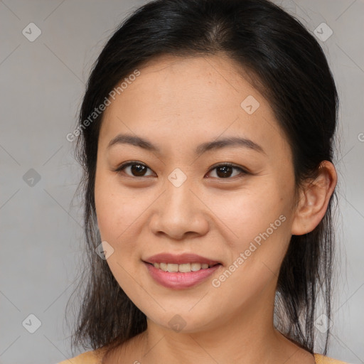 Joyful asian young-adult female with medium  brown hair and brown eyes