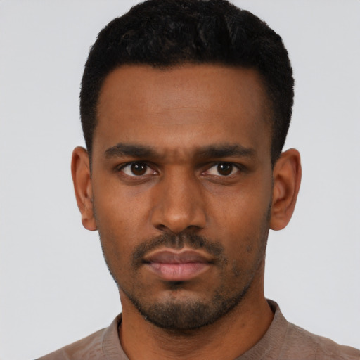 Neutral black young-adult male with short  black hair and brown eyes