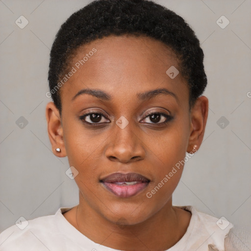 Joyful black young-adult female with short  black hair and brown eyes