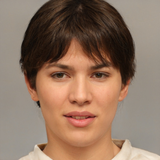 Joyful white young-adult female with medium  brown hair and brown eyes