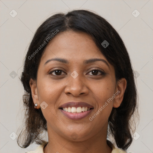 Joyful black young-adult female with medium  black hair and brown eyes