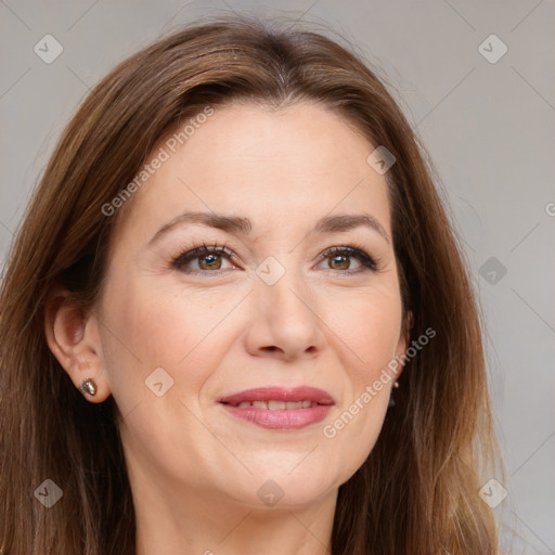 Joyful white adult female with long  brown hair and brown eyes