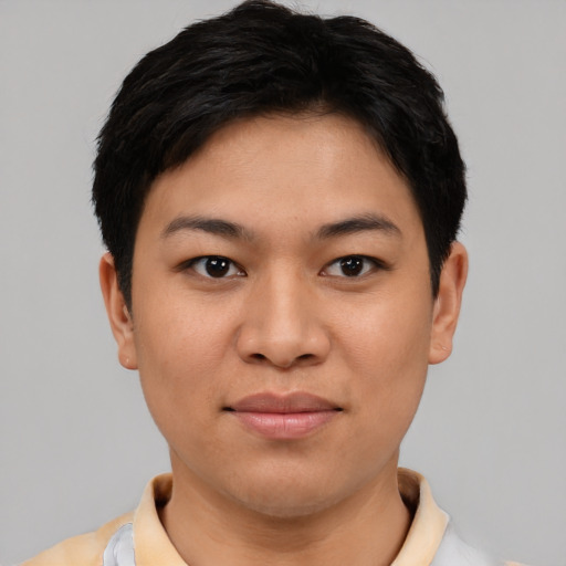 Joyful latino young-adult female with short  black hair and brown eyes