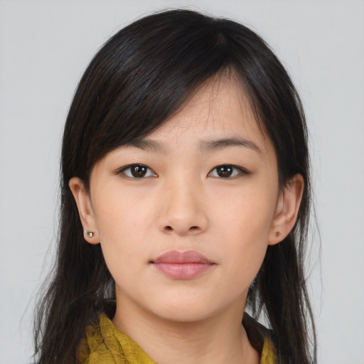 Neutral asian young-adult female with medium  brown hair and brown eyes