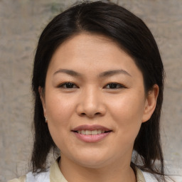 Joyful asian young-adult female with medium  brown hair and brown eyes