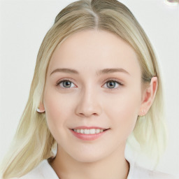 Joyful white young-adult female with long  brown hair and blue eyes