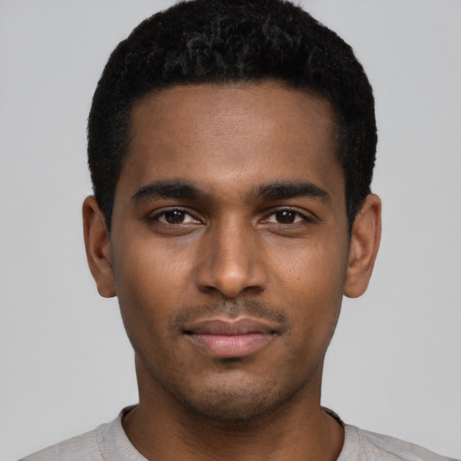 Neutral black young-adult male with short  black hair and brown eyes