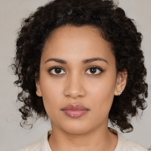 Neutral latino young-adult female with medium  brown hair and brown eyes
