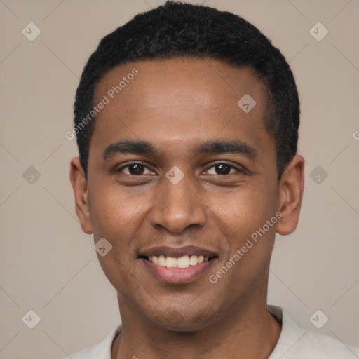 Joyful black young-adult male with short  black hair and brown eyes