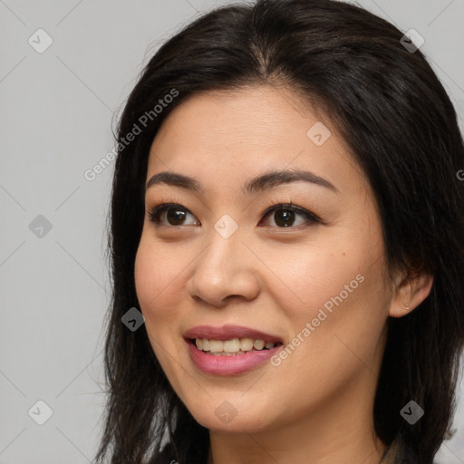 Joyful white young-adult female with long  brown hair and brown eyes