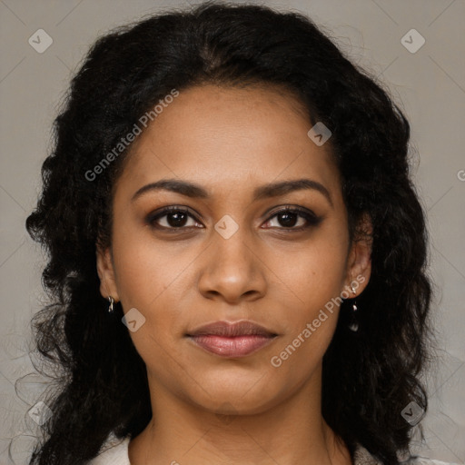 Joyful black young-adult female with long  black hair and brown eyes