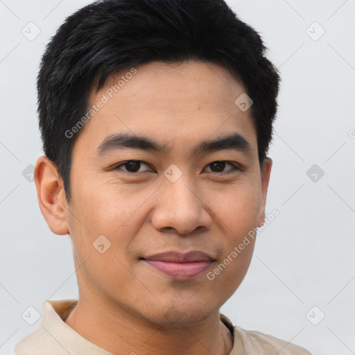 Joyful asian young-adult male with short  black hair and brown eyes